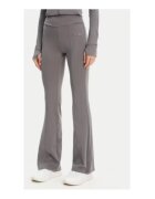 Guess Pantaloni de trening cu croiala evazata - talie inalta si logo metalic discret