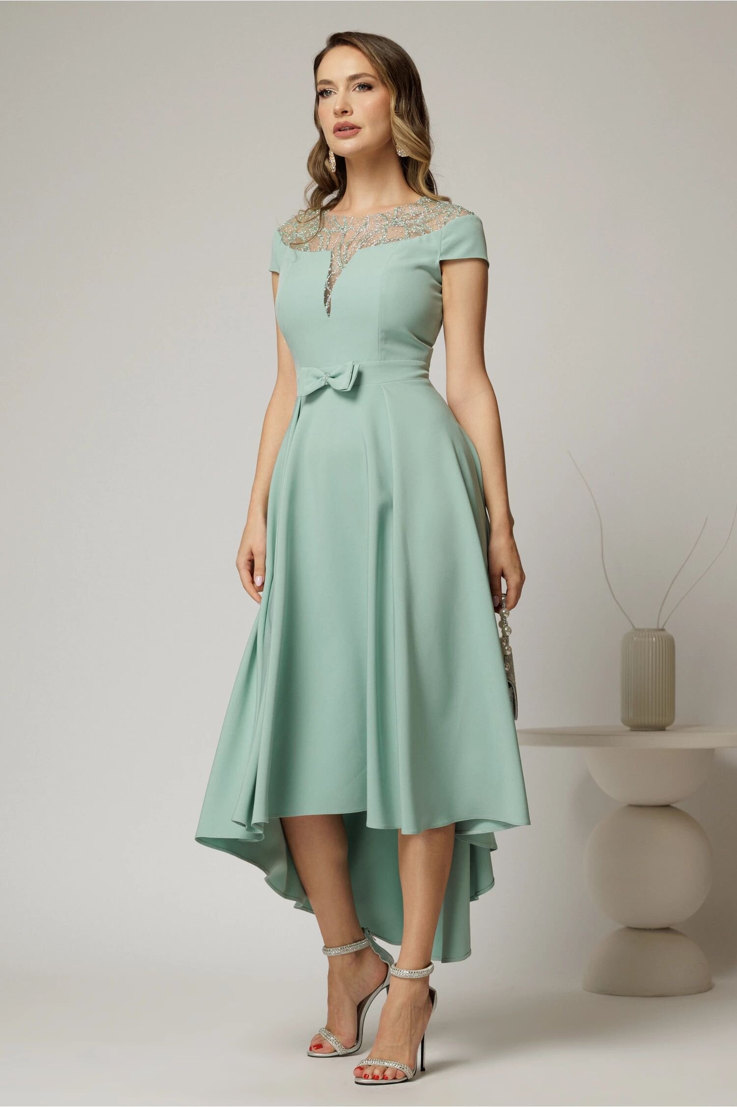  Rochie DY Fashion asimetrica verde menta cu funda in talie si aplicatii la decolteu