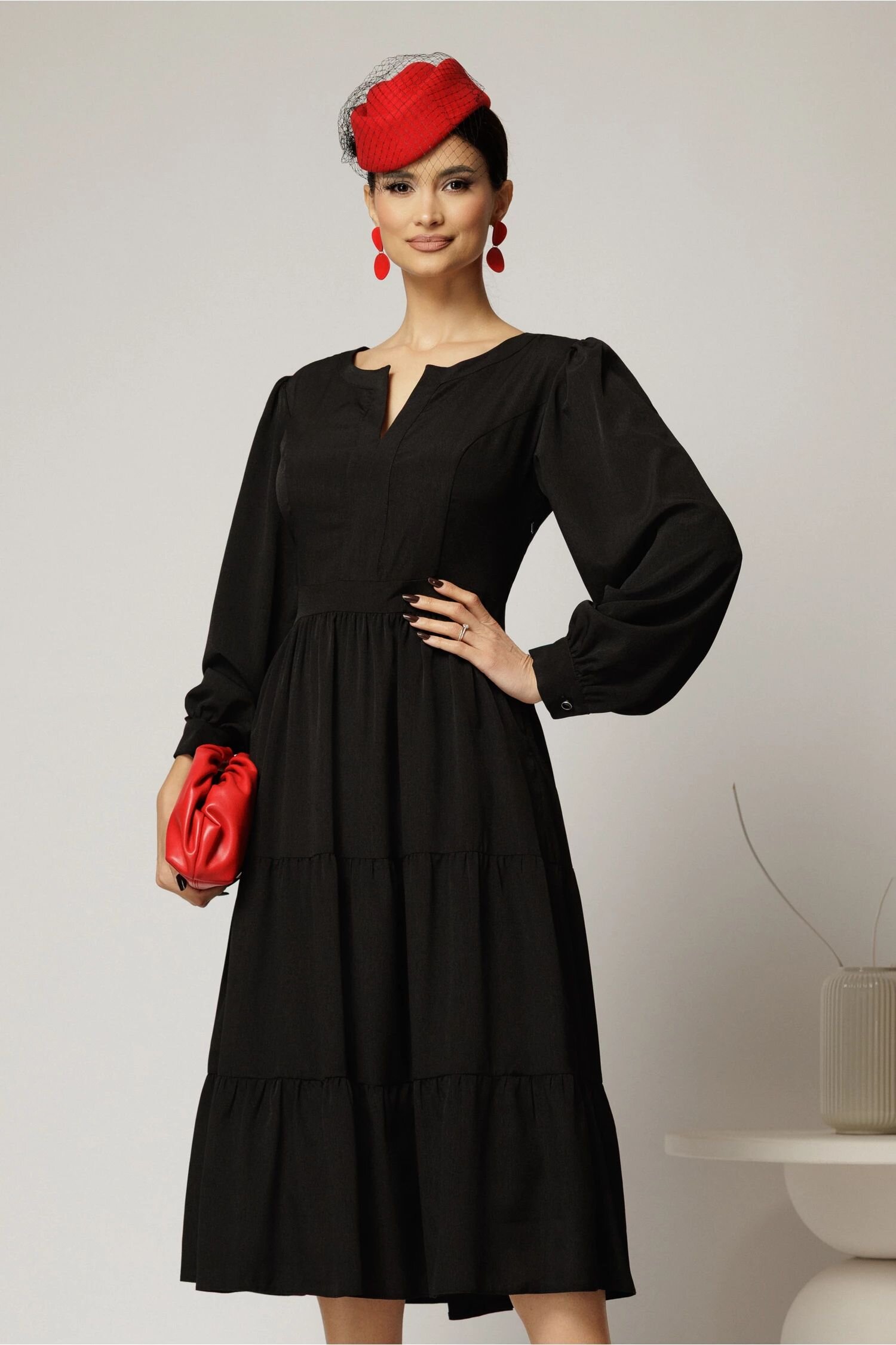  Rochie midi neagra cu volan la fusta si decolteu discret in V