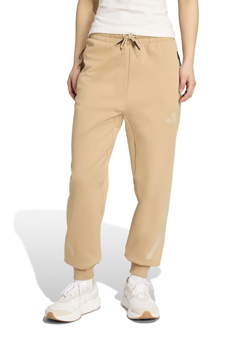 adidas Sportswear Pantaloni de trening cu buzunare cu fermoar Z.N.E. - Bej