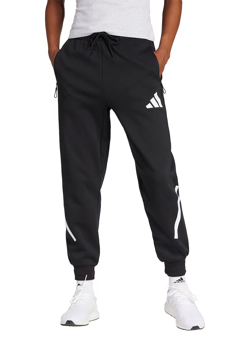 adidas Sportswear Pantaloni de trening cu buzunare cu fermoar Z.N.E. - Negru/Alb optic