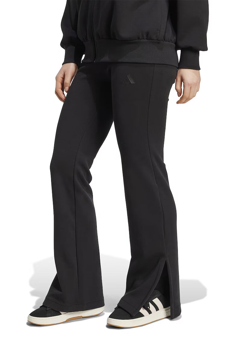 adidas Sportswear Pantaloni de trening cu croiala evazata si slituri la terminatie - Negru