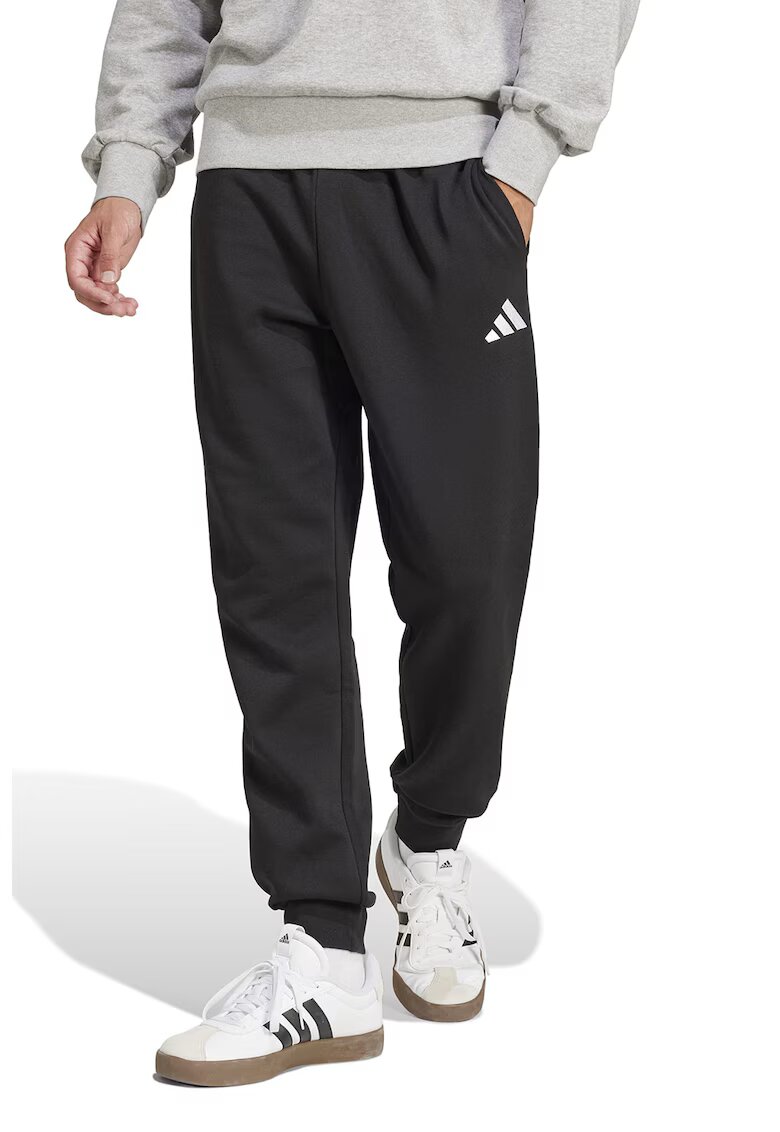 adidas Sportswear Pantaloni de trening cu snur in talie si croiala conica FeelCozy - Alb/Negru