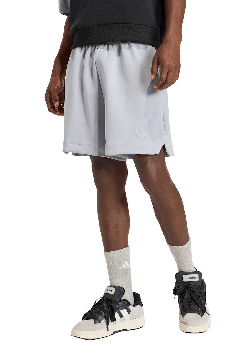 adidas Sportswear Pantaloni scurti relaxed fit din amestec de modal cu buzunare laterale - Gri cenusiu