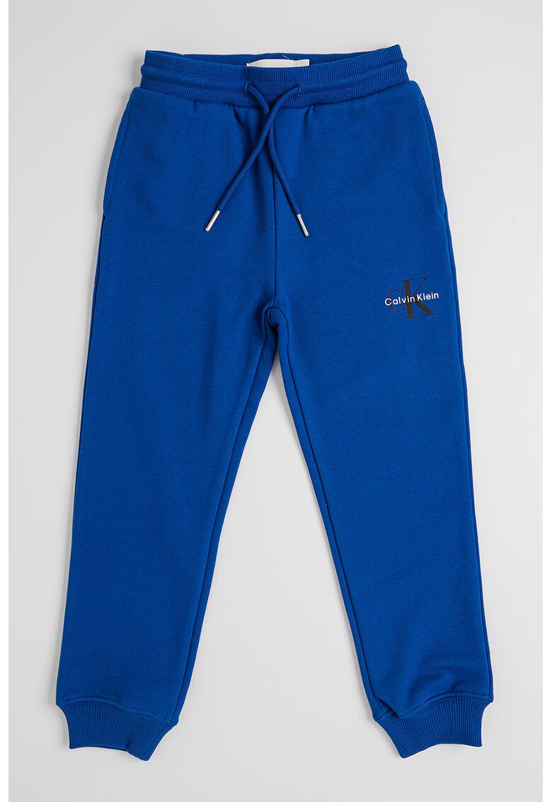Calvin Klein Pantaloni relaxed fit de trening cu imprimeu logo discret - Albastru royal