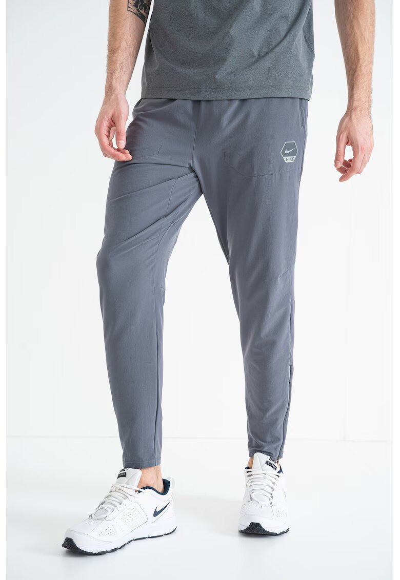 Nike Pantaloni conici de trening cu logo - Kaki