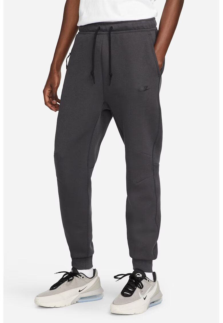 Nike Pantaloni de trening cu buzunare cu fermoar - Gri antracit