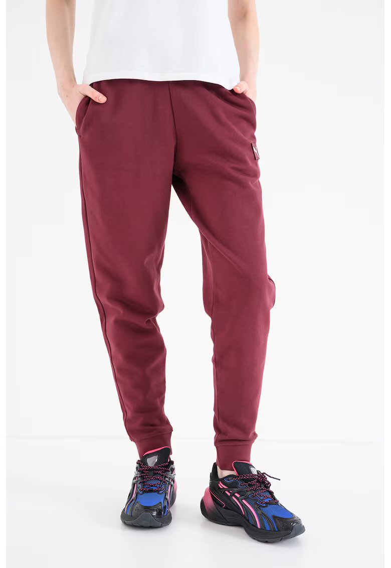 Puma Pantaloni de trening cu aplicatie logo Ess Elevated - Violet tyrian
