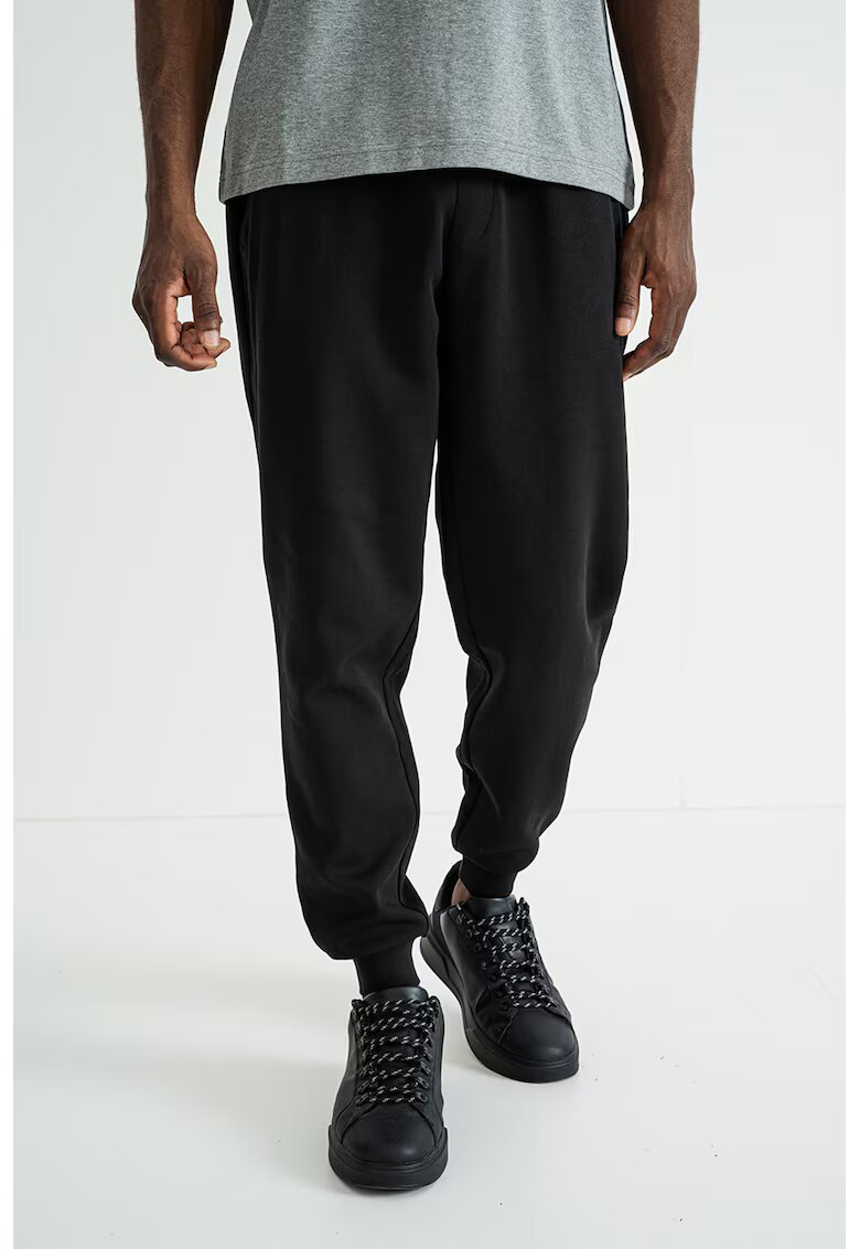 Tommy Hilfiger Pantaloni uni de trening din amestec de bumbac - Negru
